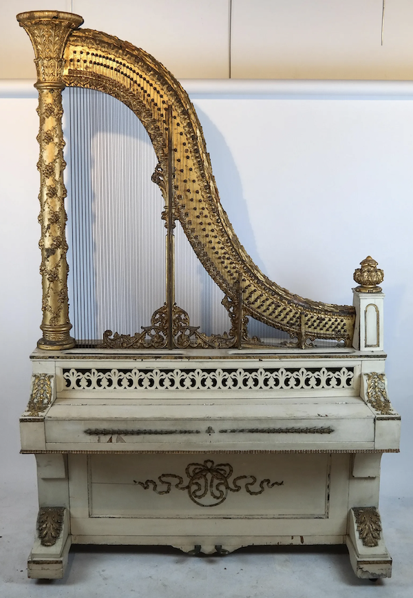 An antique giraffe piano, so called because its piano harp is exposed and mounted vertically, sold for $5,500 plus the buyer’s premium in January 2020. Image courtesy of Roland NY and LiveAuctioneers