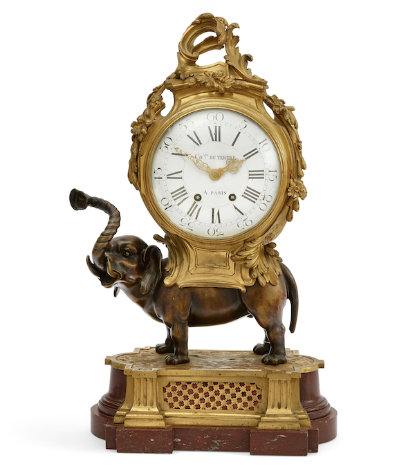 Louis XV style gilt and patinated bronze and rouge royale marble elephant form mantel clock, estimated at $3,000-$5,000
