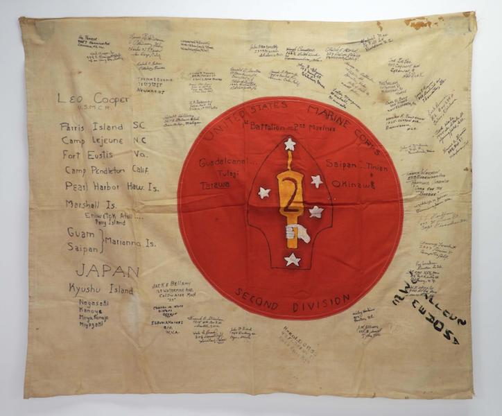 WWII Japanese flag with 2nd Marine Division insignia painted on red center, signed by 45 marines, estimated at $200-$400
