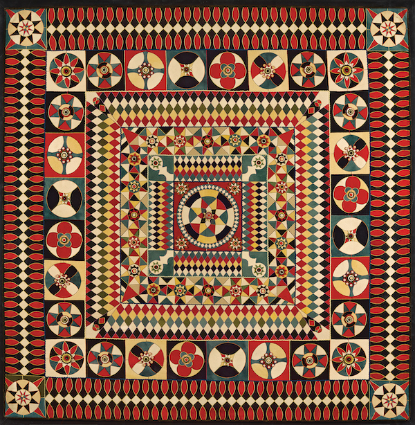 Artist unknown (India), ‘Soldier’s Quilt (detail),’ 1850-75, Wool, probably from military uniforms with embroidery thread, rickrack, and velvet binding; inlaid, layered-applique, hand embroidered. Image courtesy of the American Folk Art Museum, gift of Altria Group, Inc. Photo by Gavin Ashworth
