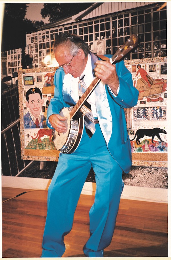 Howard Finster shown playing the banjo in an undated photo. Image by William Oppenheimer, Folk Art Society of America.