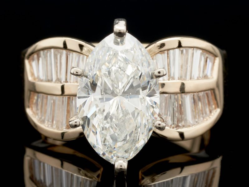 A four-carat marquise cut diamond in a 14K setting with GIA report, estimated at $24,000-$26,000