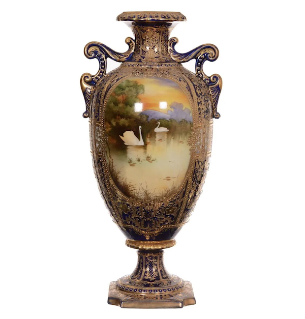 A large pedestal two-handled Nippon porcelain vase, 23-½in tall and having a medallion of two swans, realized $4,250 plus the buyer’s premium in March 2018. Image courtesy of Woody Auction LLC and LiveAuctioneers.
