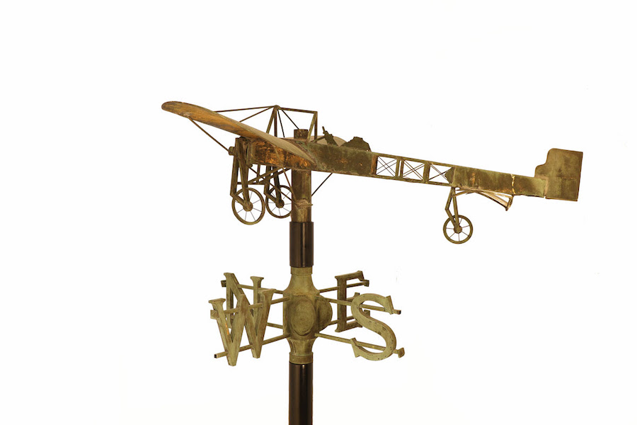 Bleriot Model XI Monoplane weathervane, circa 1909-13, copper with traces of original gilding; airplane: 57 ¼ by 55 by 10in. (145.4 by 139.7 by 25.4cm), directionals: 38 5/8 by 38 ½ by 15 ¾in. (98.1 by 97.8 by 40cm), The Metropolitan Museum of Art, gift of Michael and Patricia Del Castello. Photo credit: Michael Kent Lynberg.