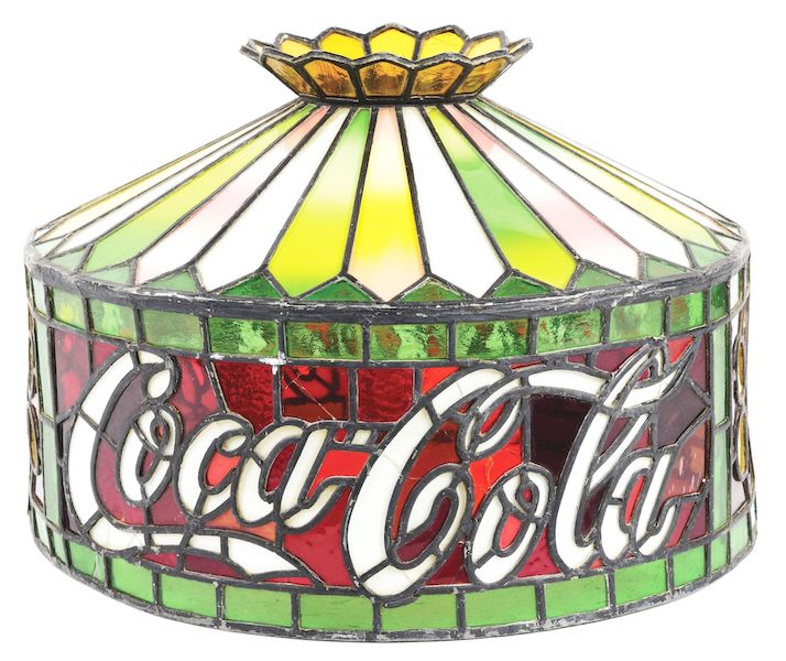 Authentic circa-1908 Coca-Cola-made lamp shade, very well constructed and featuring vividly-hued glass. Hard-to-find oversize (21in dia.) shade. Like the example in Coca-Cola’s Atlanta archives. Condition 8.5. Estimate $3,000-$10,000
