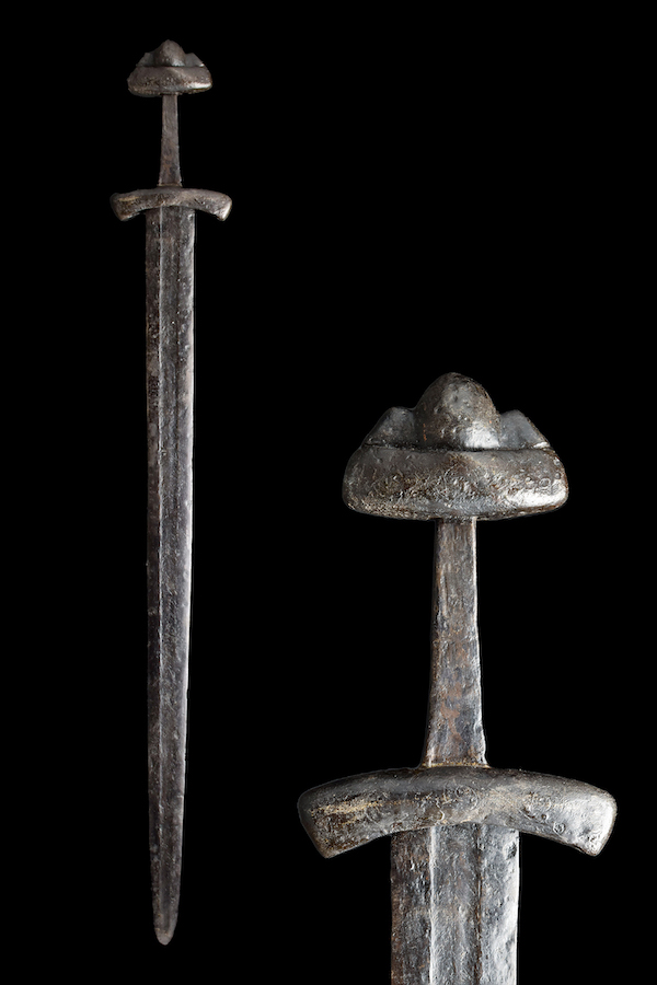 Viking forged-iron long sword with broad blade tapering to sharp point, elaborately inlaid handle, possibly once in silver; hilt having a circular pommel with raised boss. circa 900-1000 AD. Size: 942mm (37.09in); 1.02kg 2lbs 4oz). Provenance: Leeds, England private collection, acquired in 1980s/’90s. Estimate: £8,000-£15,000 ($9,294-$17,414). Image provided by Apollo Art Auctions, London