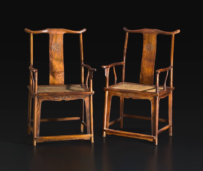 Pair of Chinese huanghuali yolk-back armchairs, estimated at $80,000-$120,000