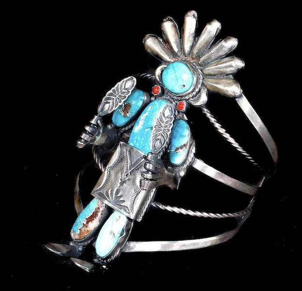 Silver, turquoise and coral Navajo cuff depicting a kachina, estimated at $200-$300