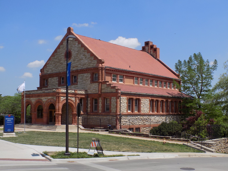 Spooner Hall, part of the Lawrence campus of the University of Kansas, photographed in May 2018. In October, university officials stated online that it has begun the process of returning Native American remains, artefacts and sacred objects found in museum collections located in Spooner Hall and other university buildings. Image courtesy of Wikimedia Commons, photo credit Gen. Quon. Shared under the Creative Commons CC0 1.0 Universal Public Domain Dedication.