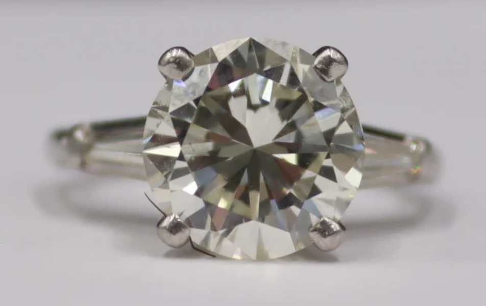 Platinum ring centered on a 4.71-carat round brilliant cut diamond, estimated at $20,000-$25,000