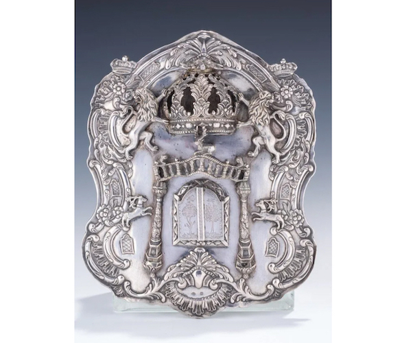 A lavishly-engraved silver Torah shield made in Poland between 1790 and 1810 earned $23,000 plus the buyer’s premium in April 2015. Image courtesy of J. Greenstein & Co., Inc. and LiveAuctioneers.