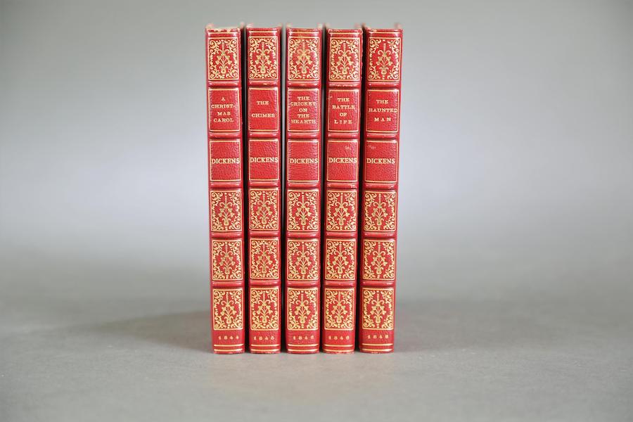 Five-volume set of ‘The Christmas Books’ by Charles Dickens (1844-1848), handsomely bound in modern ¾ red Morocco gilt over marbled boards, estimated at $1,200-$1,600. Image courtesy of Quinn’s Auction Galleries