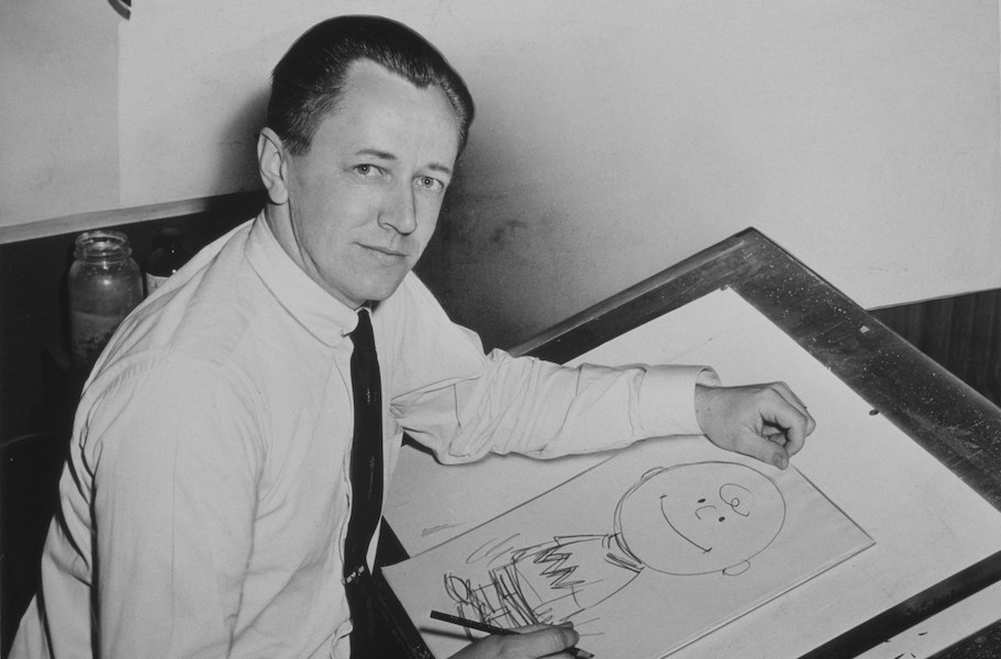 Photograph of ‘Peanuts’ cartoonist Charles Schulz, taken in 1956. On Saturday, November 26, more than 75 syndicated cartoonists will mark the centenary of Schulz’s birth by including tributes to him in their strips. Image courtesy of Wikimedia Commons, courtesy of the New York World-Telegram and Sun collection at the Library of Congress. According to the library, there are no known copyright restrictions on the use of this work.