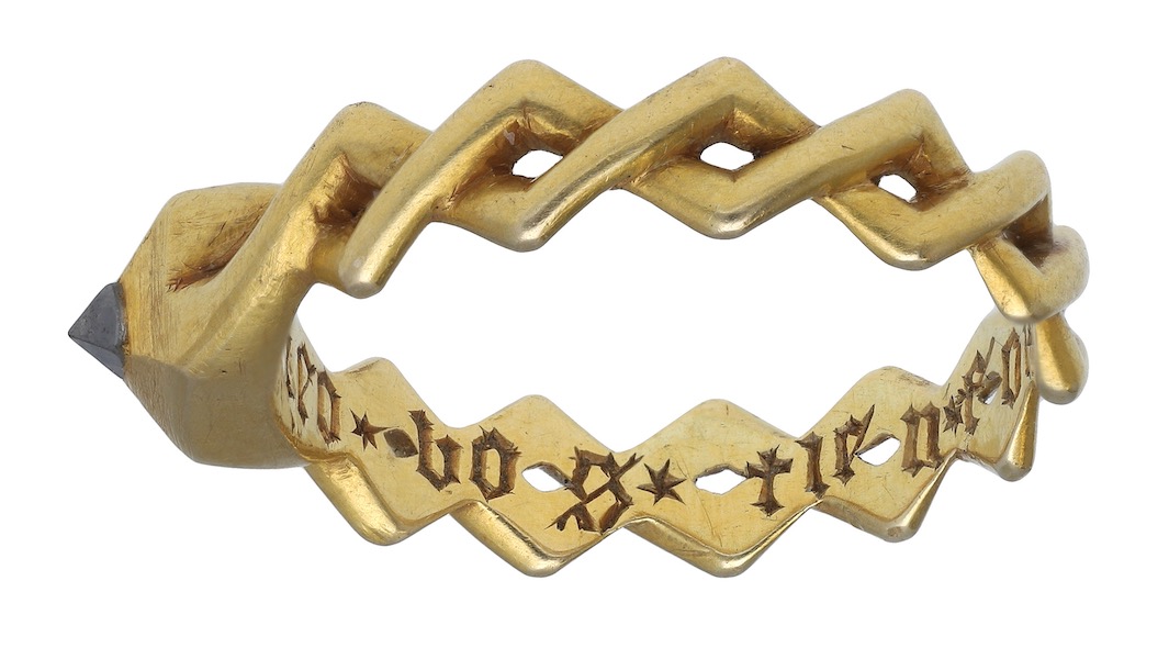 The ring, believed to date to the 14th century, bears a French inscription that translates to “I hold your faith, hold mine.” Image courtesy of Noonans