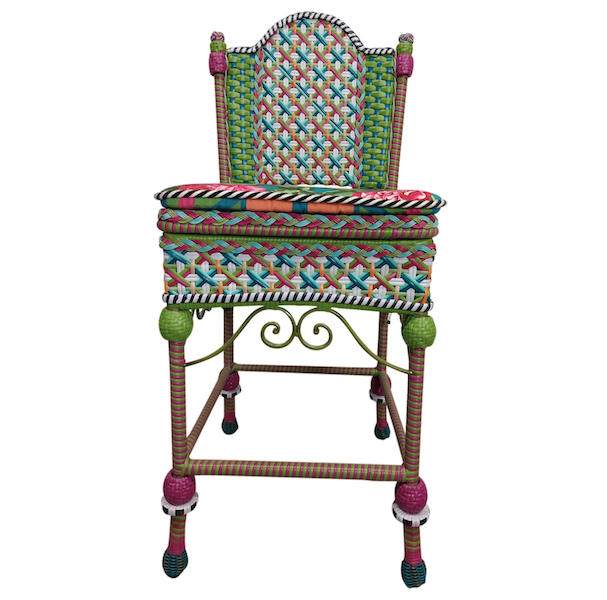 Pair of MacKenzie-Childs Greenhouse wicker chairs (one shown), estimated at $1,500-$3,000