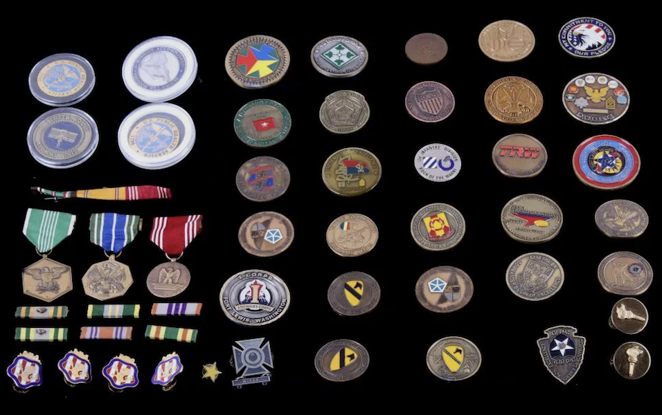 A group of 31 challenge coins from service in the Army and National Guard as well as U.S. Public Health services, plus service medals and ribbons, realized $100 plus the buyer’s premium in December 2019. Image courtesy of North American Auction Co. and LiveAuctioneers.