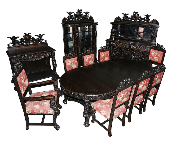 Dining set by R. J. Horner in the Oak Busted Lady pattern, $18,700