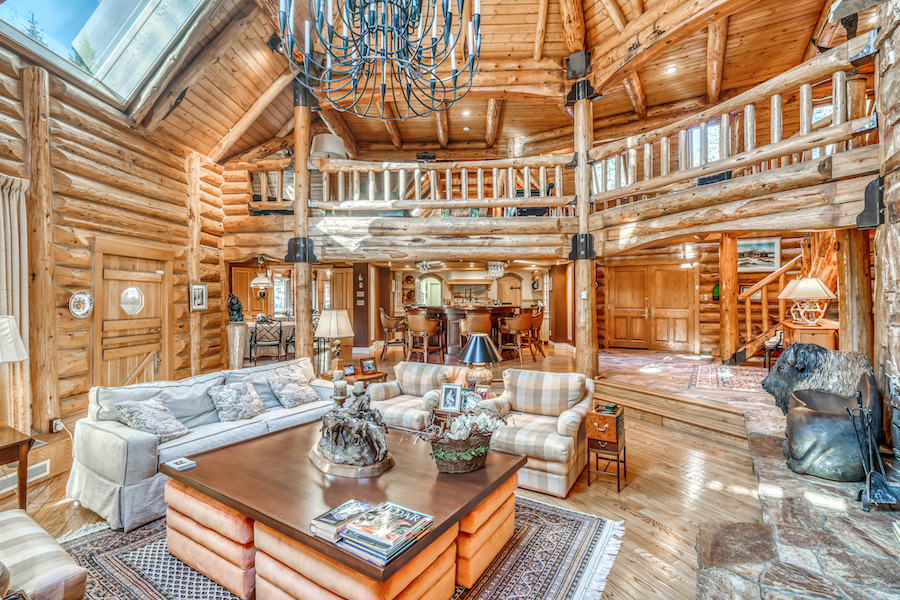 The lodge is constructed with massive logs and rugged stone. Photo courtesy of Engel & Volkers Vancouver/Sona Visual and TopTenRealEstateDeals.com