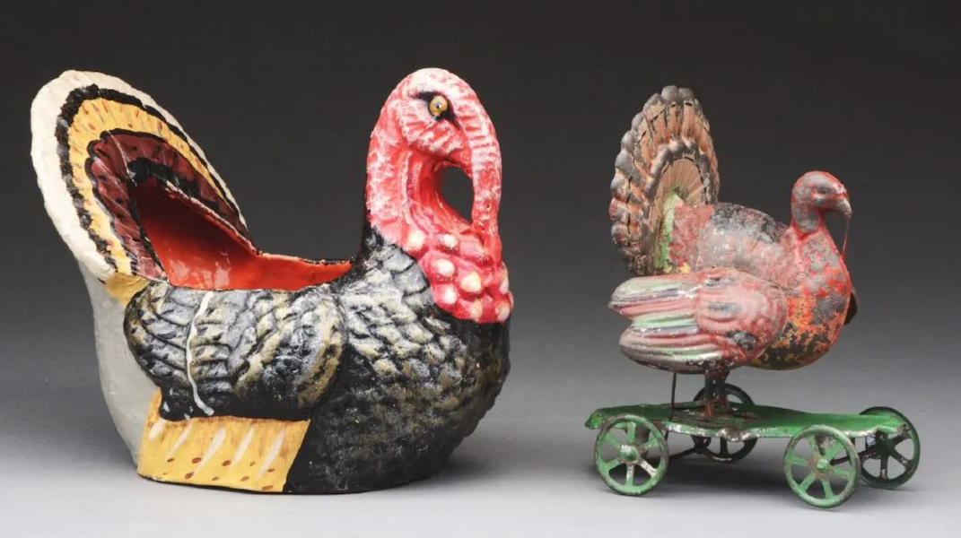 A papier-mache turkey candy container and early tin turkey on wheels sold together for $950 plus the buyer’s premium in October 2018. Image courtesy of Dan Morphy Auctions and LiveAuctioneers.