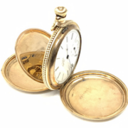 Elgin 14K gold pocket watch, ornately engraved and embossed with a floral motif, estimated at $200-$1,000
