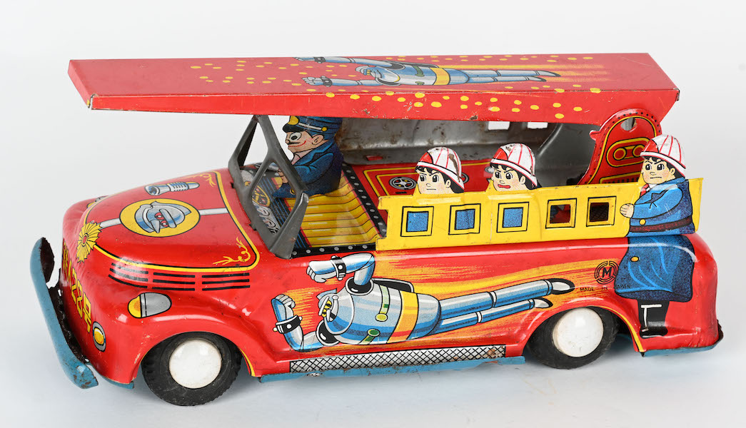 Very rare Miura (Japan) 7½in tin friction fire truck with Gigantor Tetsujin graphics on both sides of the vehicle as well as the hood and ladder. Super example of an elusive superhero toy. Sold for $11,377, nearly three times the high estimate. Image courtesy of Milestone Auctions