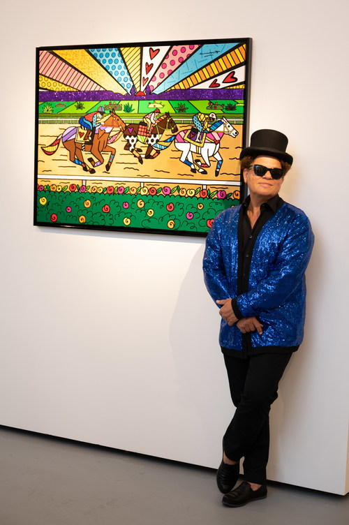 Romero Britto with the official art of the 2023 Kentucky Derby. Image provided by Churchill Downs