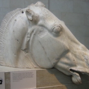 Part of the group of ancient Greek sculptures known as the Elgin Marbles, aka the Parthenon Sculptures, photographed on display at the British Museum in August 2006. On December 3, a Greek newspaper claimed that museum officials and the Greek prime minister had conducted secret talks regarding the possible return of the sculptures. Image courtesy of Wikimedia Commons, photo credit Urban. Shared under the Creative Commons Attribution-Share Alike 2.5 Generic license.
