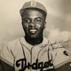 1953 image of Jackie Robinson, as he appears on his Topps baseball card from that year, estimated at $26,000-$31,000