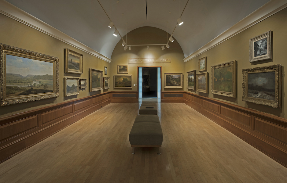 Installation shot of the salon-style layout of George Inness: Visionary Landscapes. Photo credit Peter Jacobs 