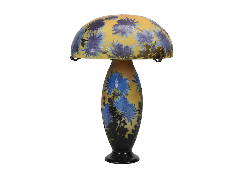 This circa-1920 signed Galle French cameo art glass lamp, having a yellow ground decorated with chrysanthemum overlay and butterflies, brought $85,000 plus the buyer’s premium at Woody Auction in October 2022. Image courtesy of Woody Auction LLC and LiveAuctioneers.