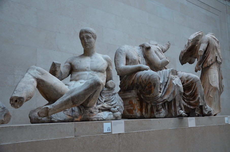 Part of the group of ancient Greek sculptures known as the Elgin Marbles, aka the Parthenon Sculptures, photographed on display at the British Museum in May 2014. On December 3, a Greek newspaper claimed that museum officials and the Greek prime minister had conducted secret talks regarding the possible return of the sculptures. Image courtesy of Wikimedia Commons, photo credit Carole Raddato. Shared under the Creative Commons Attribution-Share Alike 2.0 Generic license.