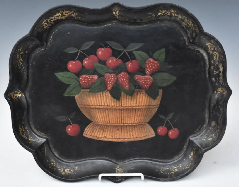 This papier-mache tray featuring a painting of a bowl of strawberries at its center sold for $800 plus the buyer’s premium in July 2017. Image courtesy of Fairfield Auction, LLC, and LiveAuctioneers.