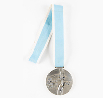 Silver medal won by Soviet ice hockey player Sergei Starikov when the USSR beat Sweden in the contest for second place at the 1980 Winter Olympics in Lake Placid, $86,136