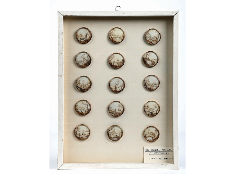 Extremely rare 18th-century set of 15 hair ‘painted’ buttons, many depicting nautical or fishing scenes, with paperwork. Displayed in wood box under glass. Sold within estimate for $34,440. Image courtesy of Morphy Auctions