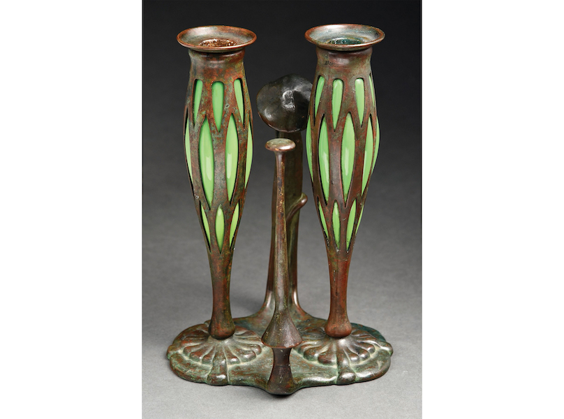 Tiffany Studios blown-out double candlestick on patinated bronze lily pad base. Sold within estimate for $20,910. Image courtesy of Morphy Auctions
