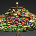 Detail of Tiffany Studios Nasturtium leaded-glass table lamp on telescoping cat’s-paw base. Sold within estimate for $123,000. Image courtesy of Morphy Auctions