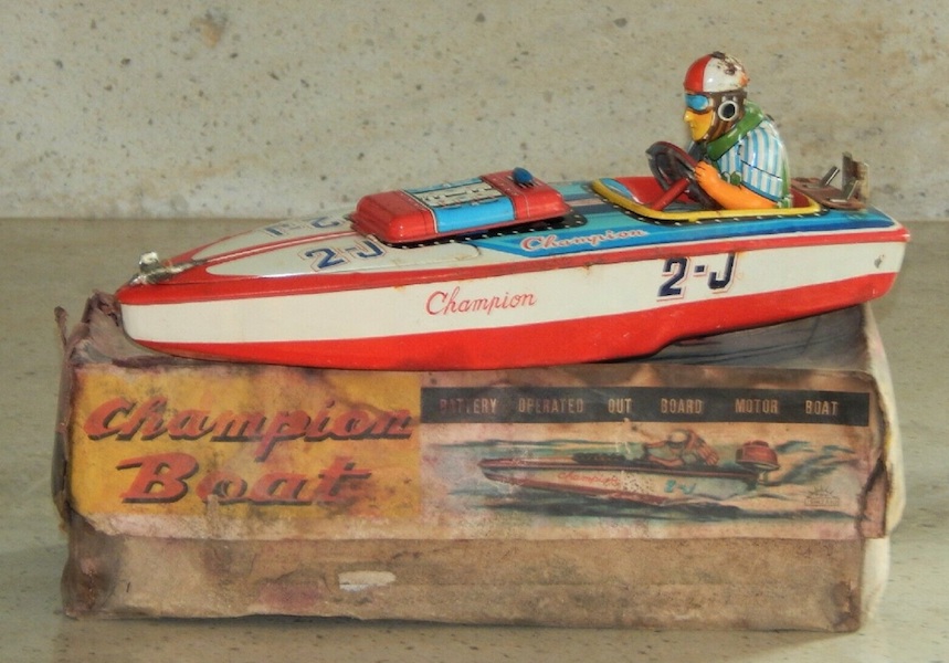 Japanese SAN Marusan Champion 2-J battery-operated tin toy speed boat with driver in the original box, estimated at $250-$500 