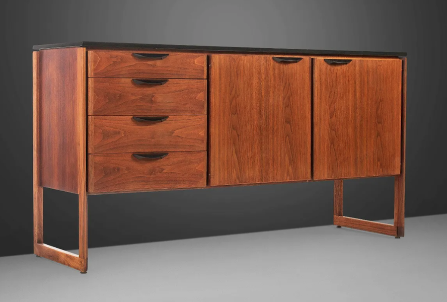 This Jens Risom circa-1960s fully restored sideboard/credenza in walnut on a sled base brought $5,500 plus the buyer’s premium in August 2022. Image courtesy of Bidhaus and LiveAuctioneers.