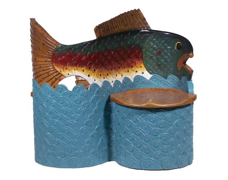 Stephen Huneck carved fish design tete-a-tete chair, estimated at $3,000-$5,000. Image courtesy of Thomaston Place Auction Galleries