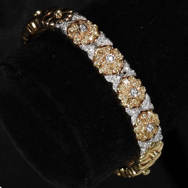 18K gold and diamond flower-decorated cuff bracelet, estimated at $1,500-$2,000