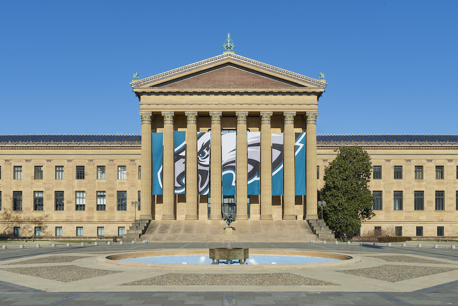The Philadelphia Museum of Art displaying a Philadelpia Eagles banner on its exterior. It and the Nekson-Atkins Museum of Art in Kansas City, Mo., which is cheering on the Kansas City Chiefs, have placed a friendly Super Bowl bet: The loser has to loan the winner a choice work of art from its collection. Images courtesy of the Nelson-Atkins Museum of Art and the Philadelphia Museum of Art