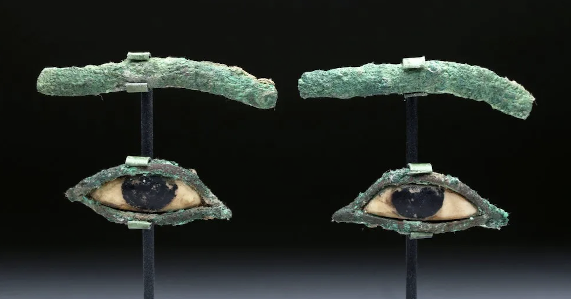 This pair of ancient Egyptian bronze and limestone eyes and eyebrows from a wooden sarcophagus mummy mask sold for $850 in June 2015. Image courtesy of Artemis Gallery and LiveAuctioneers