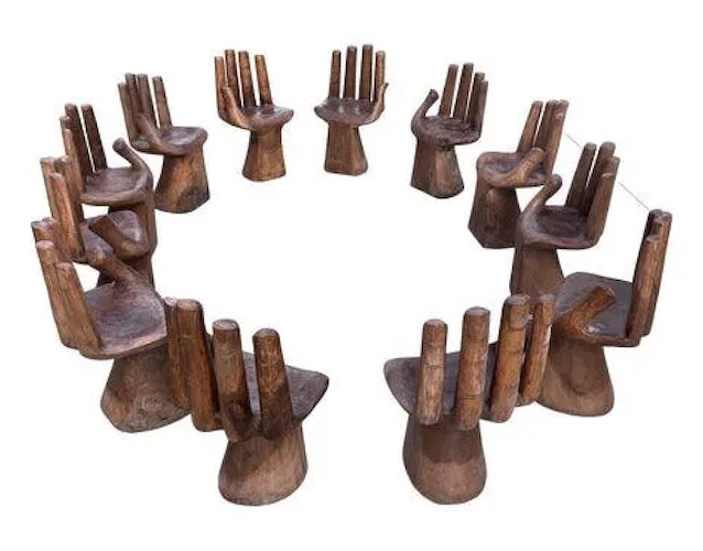 1970s set of 12 wooden hand-form chairs, estimated at $12,000-$14,000