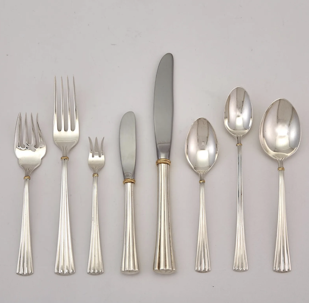 Detail from Cartier Des Must sterling silver flatware service for 24, $15,120. Image courtesy of Doyle and LiveAuctioneers