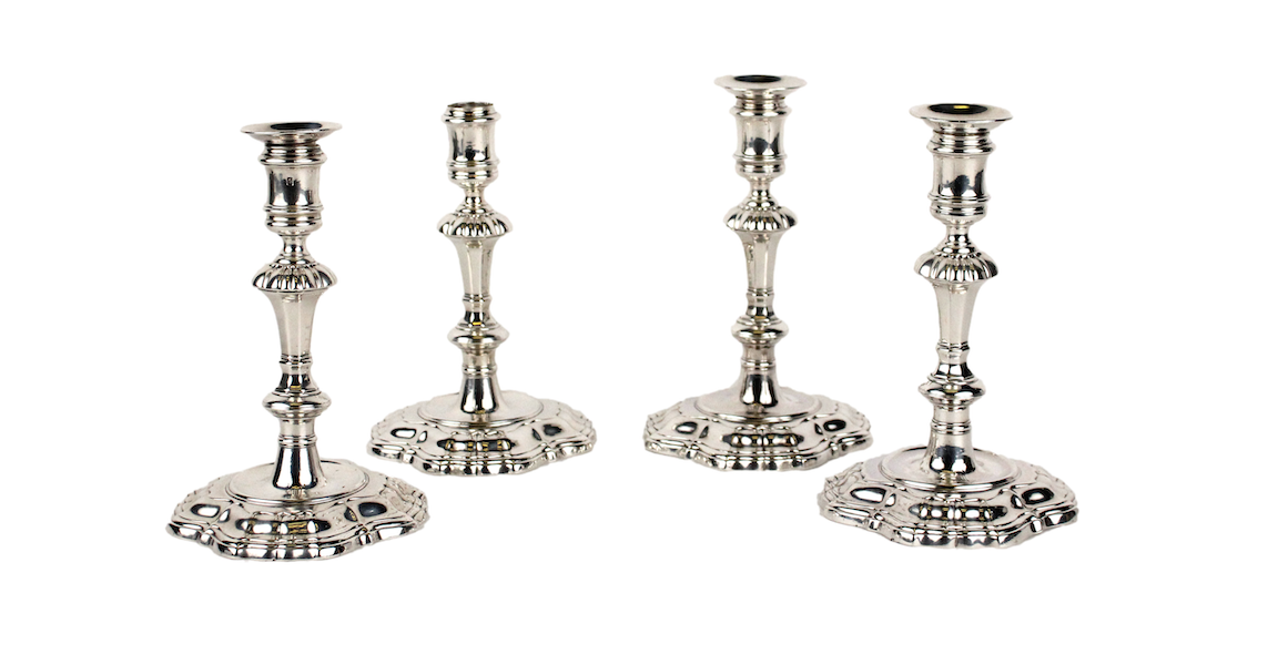 Set of four George II sterling baluster-form candlesticks, estimated at $6,000-$9,000