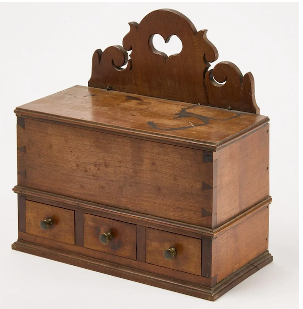 A Lancaster, Pennsylvania spice box decorated with heart cut outs made $8,500 plus the buyer’s premium in January 2022. Image courtesy of New England Auctions - Fred Giampietro and LiveAuctioneers.
