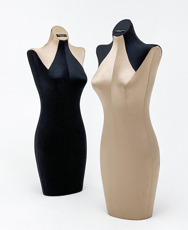 Geoffrey Beene mannequins, set of two, both covered with satin champagne and black fabric, estimated at $1,200-$1,800 