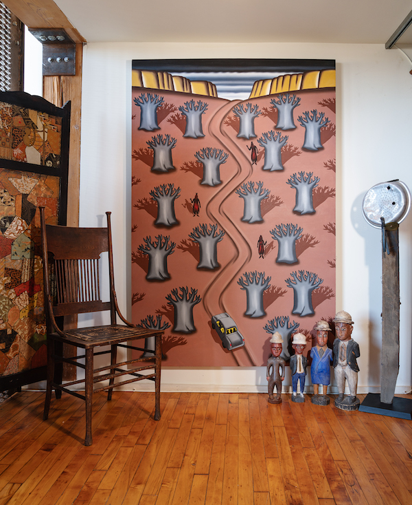 Roger Brown’s ‘Crossing the Bandiagara Escarpment With Baobab Trees and Dogon Dancers,’ pictured in collector Susann Craig’s Chicago loft. Image courtesy of Hindman