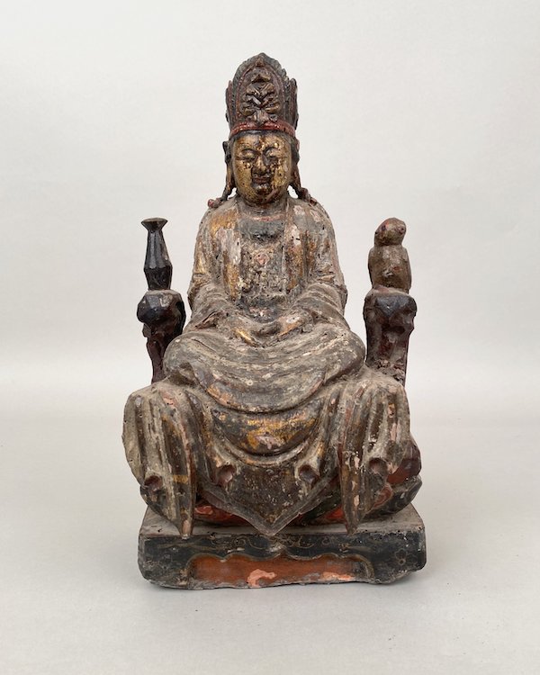 Sino-Tibetan polychrome carved wooden seated Guanyin figure, estimated at $50-$5,000