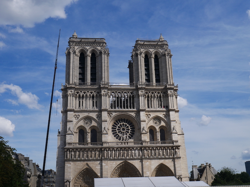 Notre Dame Cathedral in Paris, photographed several weeks after the April 2019 fire that ravaged the 12th-century structure. French officials said the reconstruction work is moving apace, and the cathedral should be ready to reopen by December 2024. Image courtesy of Wikimedia Commons, photo credit Victor Perea Ros. Shared under the Creative Commons Attribution-Share Alike 4.0 International license.